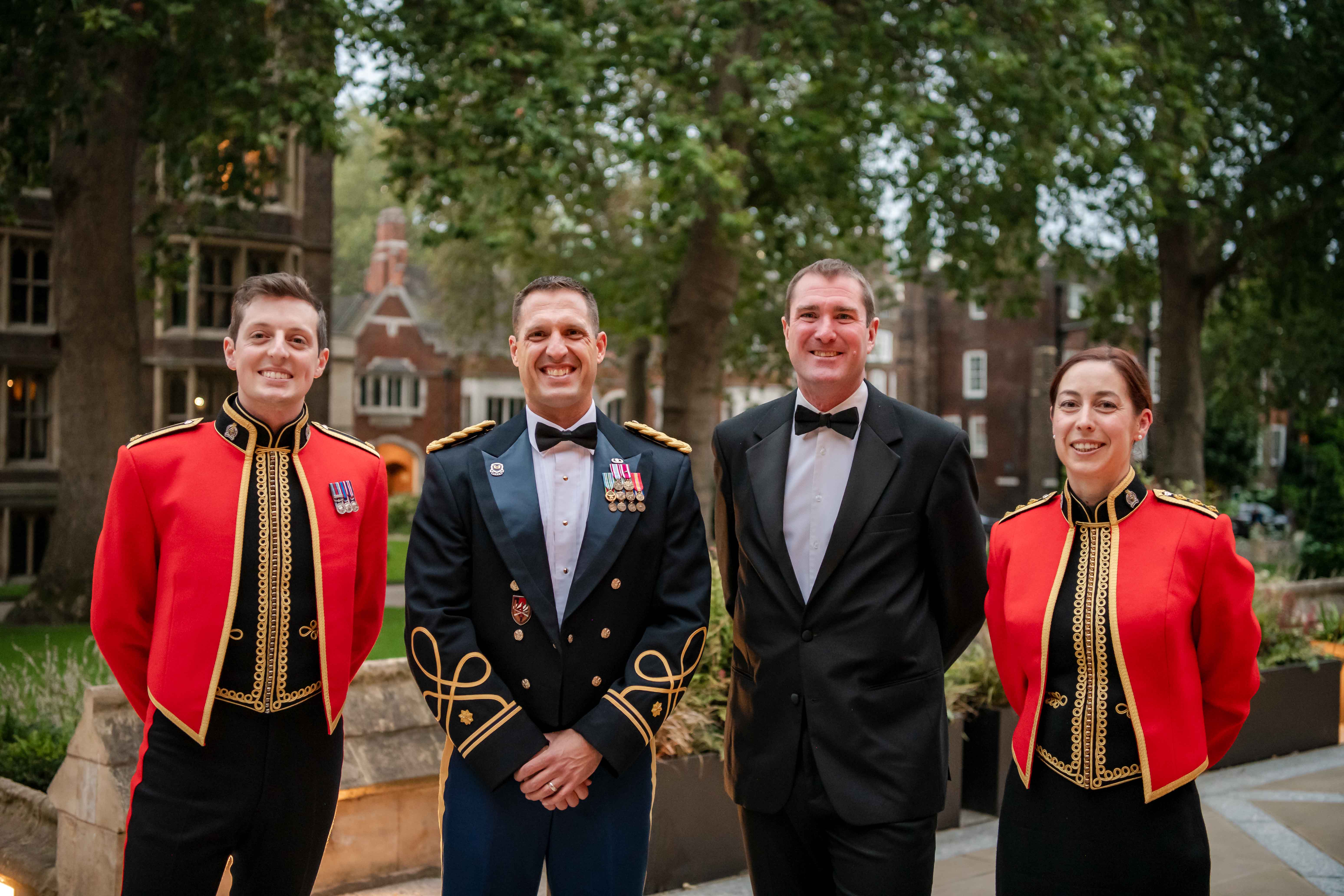 (From left to right) Major Steve Warburton, MAJ Chris Chatelain, Major James Trescothic-Martin, and Captain Kathleen Brook attend the British Army Legal Services 75th Anniversary Dinner in London, England. (Photo courtesy of author)